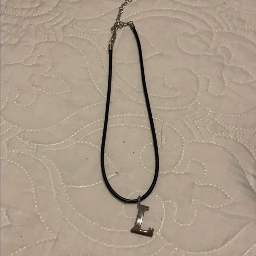 Rubber cord necklace with silver colored L